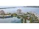 Aerial view of the condo building, lake, pool, and surrounding properties at 6287 Bahia Del Mar Cir # 404, St Petersburg, FL 33715