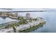 Condo building on the water with mature palm trees and lush landscaping at 6287 Bahia Del Mar Cir # 404, St Petersburg, FL 33715