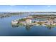 Aerial view of waterfront condo building, lake, bridge, and city skyline at 6287 Bahia Del Mar Cir # 404, St Petersburg, FL 33715