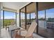 A large, covered balcony with outdoor seating offers a comfortable place to relax at 6287 Bahia Del Mar Cir # 404, St Petersburg, FL 33715