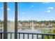A picturesque view of the lake fountain, homes, and palm trees from the balcony at 6287 Bahia Del Mar Cir # 404, St Petersburg, FL 33715