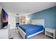 A lovely bedroom features bright walls, tile floors, and an attached bathroom at 6287 Bahia Del Mar Cir # 404, St Petersburg, FL 33715