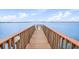 Wooden dock extending over tranquil water with a bridge view at 6287 Bahia Del Mar Cir # 404, St Petersburg, FL 33715