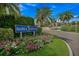 The Bahia Pointe entrance is marked by lush landscaping, including colorful flowers and mature palm trees at 6287 Bahia Del Mar Cir # 404, St Petersburg, FL 33715
