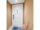 Condo entrance featuring unit number 404, a Welcome mat, and neutral wall color at 6287 Bahia Del Mar Cir # 404, St Petersburg, FL 33715