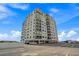 Exterior shot of the condo building featuring multiple balconies and on-site parking at 6287 Bahia Del Mar Cir # 404, St Petersburg, FL 33715