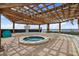 Inviting hot tub under a wooden pergola with a serene ocean backdrop at 6287 Bahia Del Mar Cir # 404, St Petersburg, FL 33715