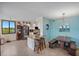 Bright kitchen with a breakfast bar, stainless steel appliances, and a dining area with a rustic table at 6287 Bahia Del Mar Cir # 404, St Petersburg, FL 33715