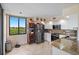 Bright kitchen features stainless steel appliances, granite countertops, and a view to the outside at 6287 Bahia Del Mar Cir # 404, St Petersburg, FL 33715