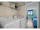 Laundry area with a washing machine and dryer that opens to a bedroom at 6287 Bahia Del Mar Cir # 404, St Petersburg, FL 33715