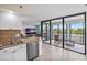 A view from the kitchen offers a view to the large living room and sliding glass doors to the balcony at 6287 Bahia Del Mar Cir # 404, St Petersburg, FL 33715