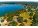 Aerial view of the community basketball and tennis courts, next to a lake and walking path at 7132 Colony Pointe Dr, Riverview, FL 33578