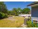 Expansive backyard features a swing set and ample space for activities, alongside a cozy patio area at 7132 Colony Pointe Dr, Riverview, FL 33578