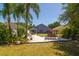 Charming backyard with patio seating, landscaping, and a relaxing swing at 7132 Colony Pointe Dr, Riverview, FL 33578