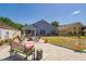 Backyard features a patio, fire pit, and ample seating for outdoor enjoyment at 7132 Colony Pointe Dr, Riverview, FL 33578