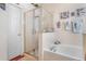 Bright bathroom features a glass enclosed shower over soaking tub at 7132 Colony Pointe Dr, Riverview, FL 33578