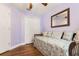 Comfortable bedroom with a daybed, closet, and a mirror at 7132 Colony Pointe Dr, Riverview, FL 33578