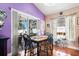 Dining room with a table set for four, bright windows, and charming décor at 7132 Colony Pointe Dr, Riverview, FL 33578