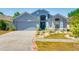 Charming home with a well-manicured lawn, tasteful landscaping, and a welcoming entrance, showcasing curb appeal at 7132 Colony Pointe Dr, Riverview, FL 33578
