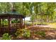 Community gazebo in the park with bench seating and landscaping at 7132 Colony Pointe Dr, Riverview, FL 33578