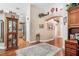 Hallway with hardwood floors leading to the kitchen; arches and decor throughout at 7132 Colony Pointe Dr, Riverview, FL 33578