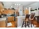 Bright kitchen with stainless steel appliances, wood cabinets, and breakfast bar at 7132 Colony Pointe Dr, Riverview, FL 33578