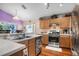 Kitchen with stainless steel appliances, wood cabinets, and a bright, airy feel at 7132 Colony Pointe Dr, Riverview, FL 33578