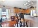 Well-lit kitchen featuring wood cabinets, stainless steel appliances, and a breakfast bar at 7132 Colony Pointe Dr, Riverview, FL 33578