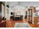 Open living room with vaulted ceilings, wood floors, and ample natural light at 7132 Colony Pointe Dr, Riverview, FL 33578
