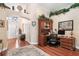 Home office with a built-in desk and shelving unit. Hardwood flooring at 7132 Colony Pointe Dr, Riverview, FL 33578