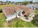 Lovely home featuring great curb appeal, complemented by mature palms and meticulous landscaping at 9253 Water Hazard Dr, Hudson, FL 34667