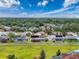 Neighborhood aerial view showcasing lush greenery and community layout at 9253 Water Hazard Dr, Hudson, FL 34667