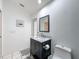 Bright bathroom features a modern vanity with marble countertop and updated fixtures at 9253 Water Hazard Dr, Hudson, FL 34667