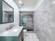 Bathroom featuring a new vanity, toilet, and tiled shower at 9253 Water Hazard Dr, Hudson, FL 34667