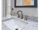 Close-up on modern bathroom vanity, displaying marble countertop and brushed nickel faucet at 9253 Water Hazard Dr, Hudson, FL 34667