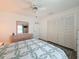 Bedroom featuring a comfy bed, closet, and neutral color scheme at 9253 Water Hazard Dr, Hudson, FL 34667