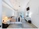 Bright bedroom featuring a ceiling fan, television, dresser, and sliding glass doors leading to the pool area at 9253 Water Hazard Dr, Hudson, FL 34667