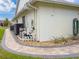 View of the home's equipment alongside the wall and landscaping at 9253 Water Hazard Dr, Hudson, FL 34667