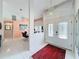 Foyer featuring tile flooring, chandelier, and view into the adjacent dining area at 9253 Water Hazard Dr, Hudson, FL 34667