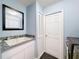 Laundry area features storage cabinets, a utility sink with granite countertop, and a large capacity washer and dryer set at 9253 Water Hazard Dr, Hudson, FL 34667