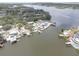 Aerial view of riverfront houses, showcasing private docks and the natural beauty of the waterfront community at 9914 Alavista Dr, Gibsonton, FL 33534