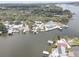 Scenic aerial photograph of waterfront houses with individual docks, with a beautiful river and lush landscape at 9914 Alavista Dr, Gibsonton, FL 33534