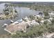 Aerial view of a waterfront neighborhood with homes, boat docks, and convenient bay access at 9914 Alavista Dr, Gibsonton, FL 33534