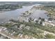 Picturesque aerial view of waterfront homes and docks along a serene river and lush greenery at 9914 Alavista Dr, Gibsonton, FL 33534