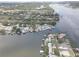 Stunning aerial perspective of waterfront residences with docks on a peaceful river surrounded by nature at 9914 Alavista Dr, Gibsonton, FL 33534