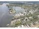 Aerial view showcasing waterfront community with bay access and plenty of lush foliage at 9914 Alavista Dr, Gibsonton, FL 33534