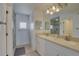 Bright bathroom features double sinks, walk in shower and lots of storage at 9914 Alavista Dr, Gibsonton, FL 33534