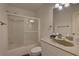 Cozy bathroom with a shower with sliding doors and granite countertops at 9914 Alavista Dr, Gibsonton, FL 33534