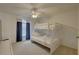 Comfortable bedroom with a bunk bed, window and ceiling fan at 9914 Alavista Dr, Gibsonton, FL 33534