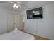 Bedroom with a double bed, a flatscreen tv, and closet for storage at 9914 Alavista Dr, Gibsonton, FL 33534
